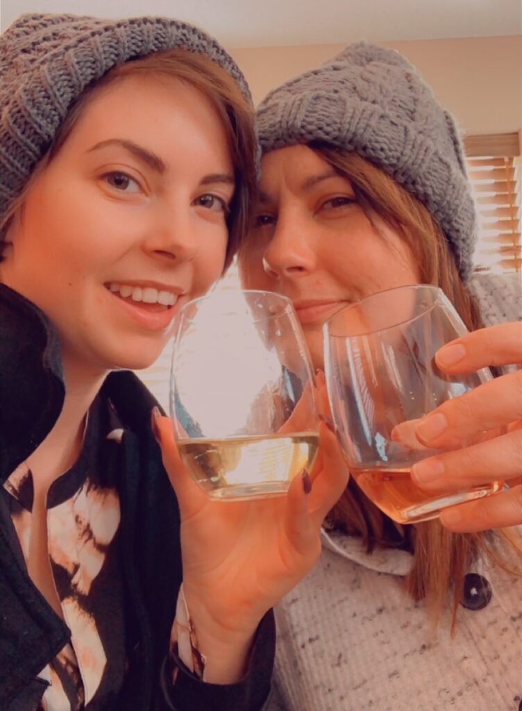 Brooklyn and their mom toasting a glass of wine together