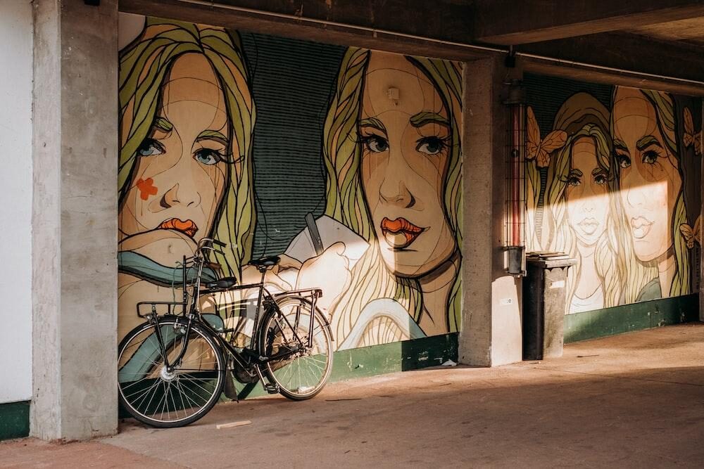 graffiti portraits of women on a wall