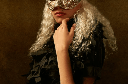 a portrait of a woman with a mask over her face
